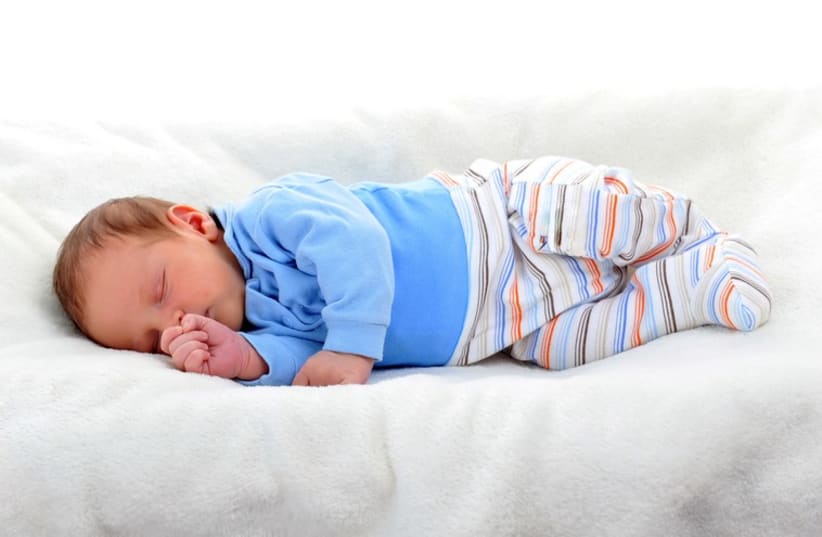 Baby boy in sleeping on bed (photo credit: ING IMAGE/ASAP)