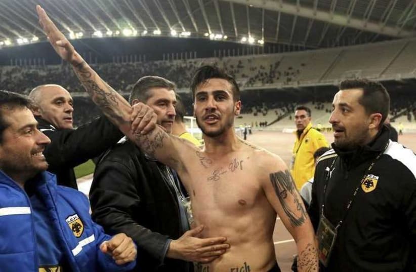 AEK Athens' Giorgos Katidis (C) celebrates a goal during a Super League soccer match by making a Nazi salute (photo credit: REUTERS)