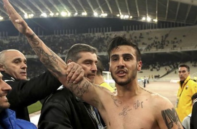 AEK Athens' Giorgos Katidis (C) celebrates a goal during a Super League soccer match by making a Nazi salute (photo credit: REUTERS)