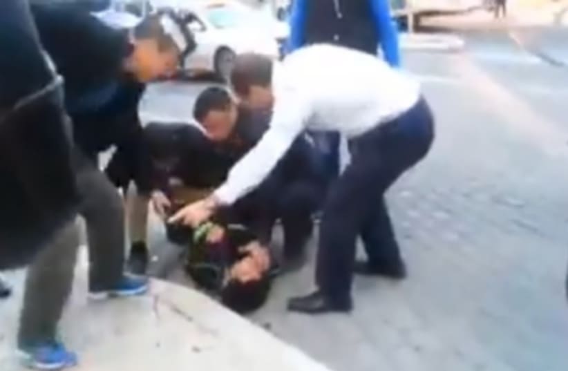 Jerusalem Mayor Nir Barkat and his security guards apprehend a Palestinian terrorist (photo credit: Courtesy)