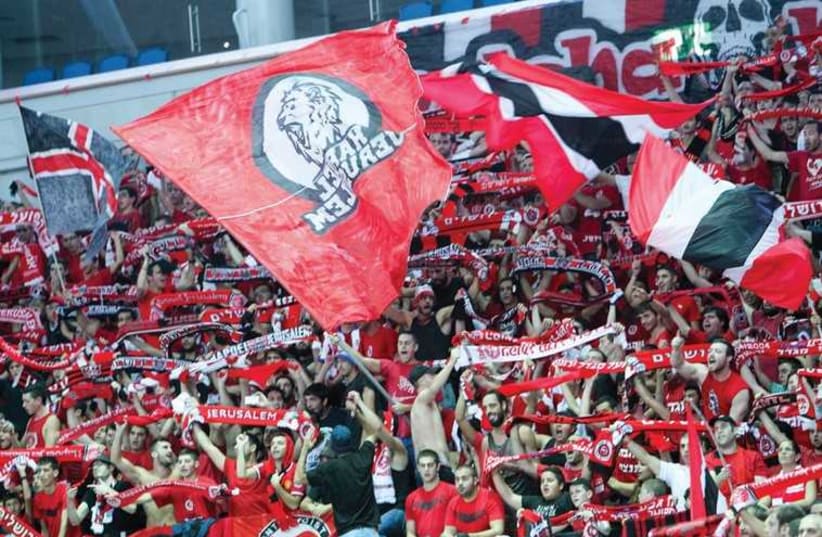 Hapoel Jerusalem’s fans cheered the team from start to finish, despite the disheartening result. (photo credit: ODED KARNI)