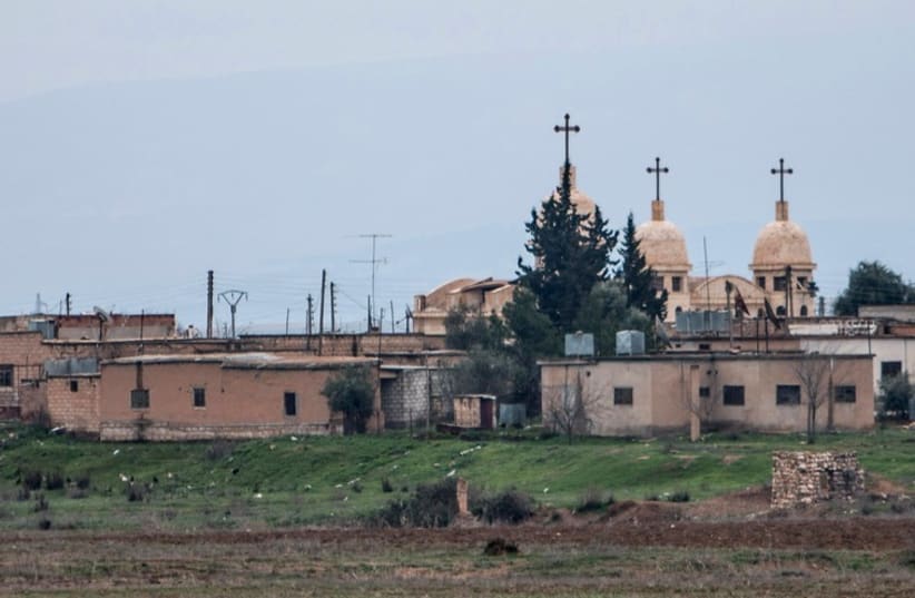 A general view shows a church in the Assyrian village of Abu Tina, which was recently captured by Islamic State fighters, February 25, 2015. (photo credit: REUTERS)