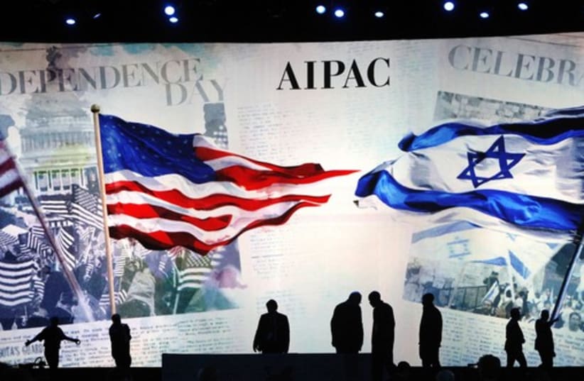Workers set the stage at the AIPAC conference in Washington, March 2 (photo credit: REUTERS)
