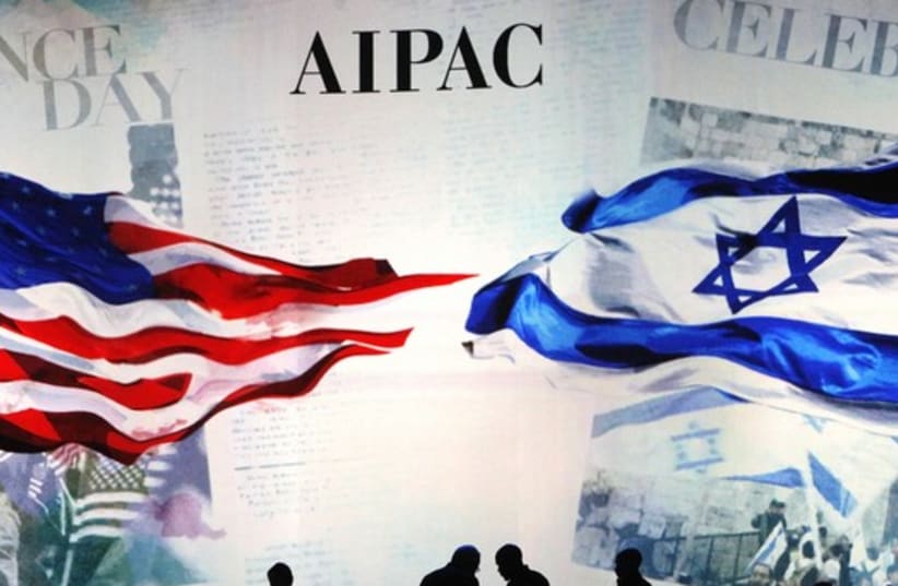 Workers set the stage at the AIPAC conference in Washington, March 2 (photo credit: REUTERS)