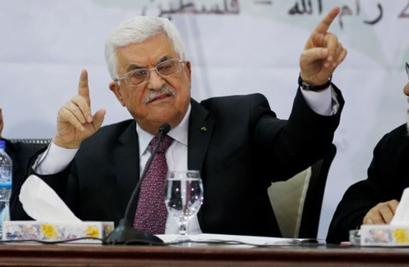 PA President Mahmoud Abbas (C)  at a meeting for the Central Council of the PLO, in Ramallah, March 4, 2015 (photo credit: REUTERS)