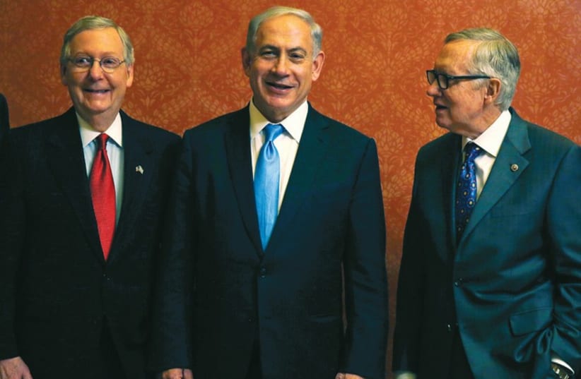 PRIME MINISTER Benjamin Netanyahu meets with US Senate Majority Leader Mitch McConnell (left) and Senate Minority Leader Harry Reid (photo credit: REUTERS)