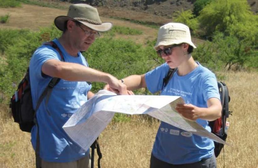 Ian Brown (left) navigates at a previous hike. (photo credit: COURTESY AKIM-JERUSALEM)