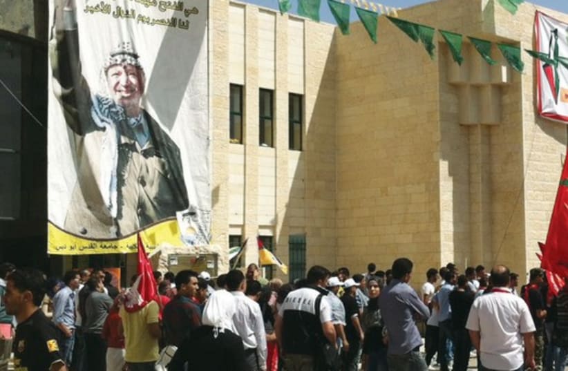 Students at Al-Quds University demonstrate during student elections in 2011. (photo credit: SETH J. FRANTZMAN)