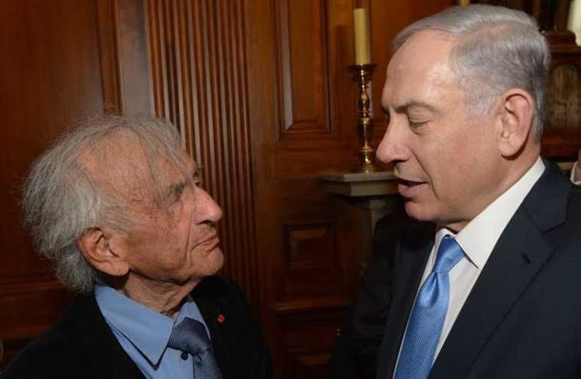 Prime Minister Benjamin Netanyahu speaks with author Elie Wiesel after speech to US Congress in Washington (photo credit: AMOS BEN-GERSHOM/GPO)