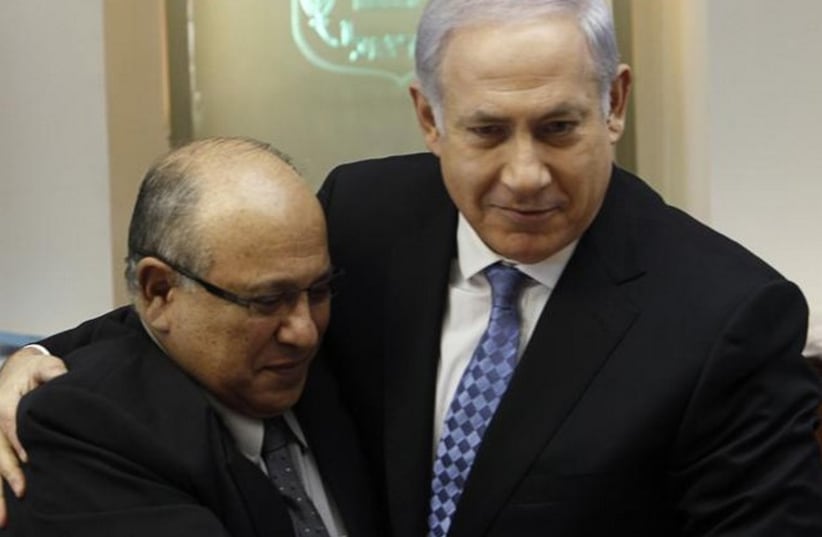 Prime Minister Benjamin Netanyahu (R) embraces former Mossad chief Meir Dagan in 2011 (photo credit: REUTERS)