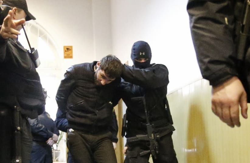 Zaur Dadayev (C), charged with involvement in the murder of Russian opposition figure Boris Nemtsov, is escorted in a court building in Moscow, March 8, 2015 (photo credit: REUTERS)