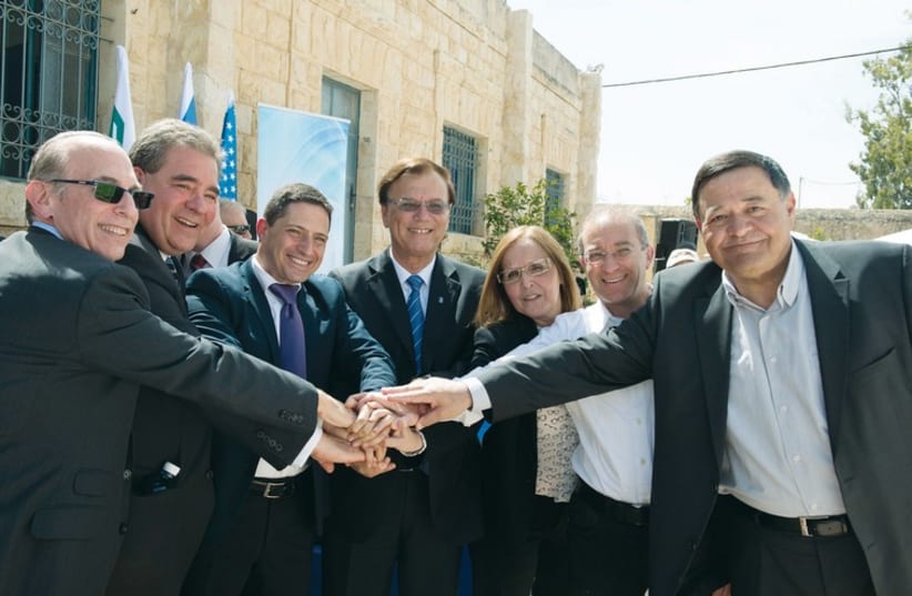 VIP guests representing residents of the Negev, BGU and JNF including Russell Robinson, CEO of the Jewish National Fund USA (second from left), Beersheba Mayor Ruvik Danilovich and KKL-JNF World Chairman Efi Stenzler celebrate the inauguration of the Lauder Employment Center, March 2015 (photo credit: courtesy)
