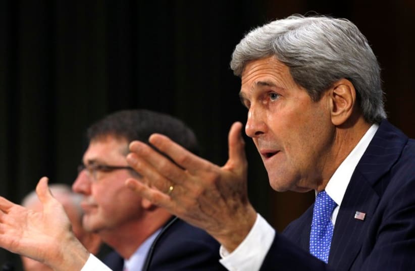 US Secretary of State John Kerry (R) speaks during a Senate Foreign Relations Committee hearing, March 11, 2015 (photo credit: REUTERS)