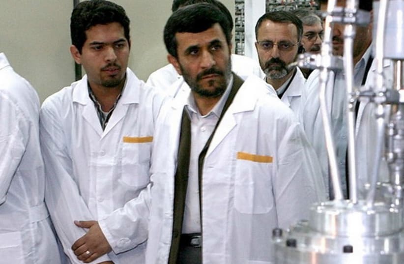 Former Iranian president Mahmoud Ahmadinejad (second left) visits the Natanz nuclear enrichment facility. (photo credit: REUTERS)