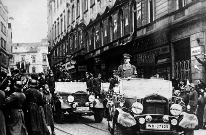 A victorious Hitler parades in just-occupied Prague: Does Buji’s optimism arouse howls of derision in Tehran’s halls of power?  (photo credit: Courtesy)