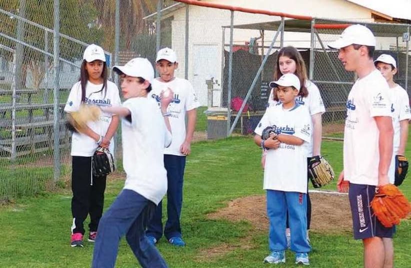 Jewish and Arab youth playing baseball together  (photo credit: MARGO SUGARMAN)