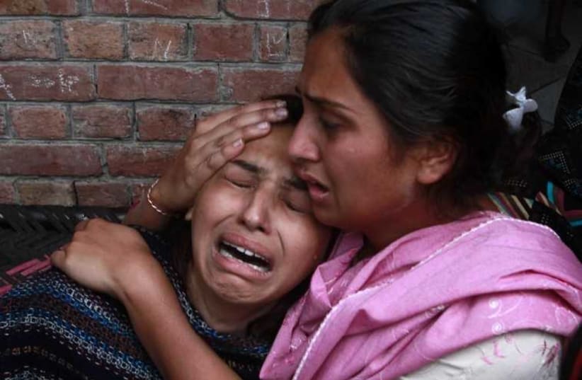 A Christian woman mourns the death of her relative who was killed in a suicide attack on a church in Lahore March 15, 2015. (photo credit: REUTERS)