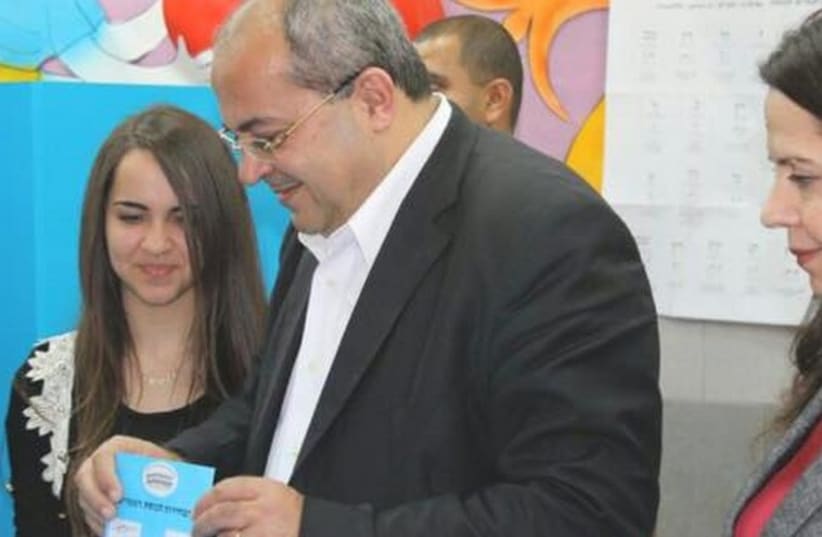 Ahmed Tibi casts his  vote near his home in Taybeh (photo credit: AHMED TIBI FACEBOOK PAGE)