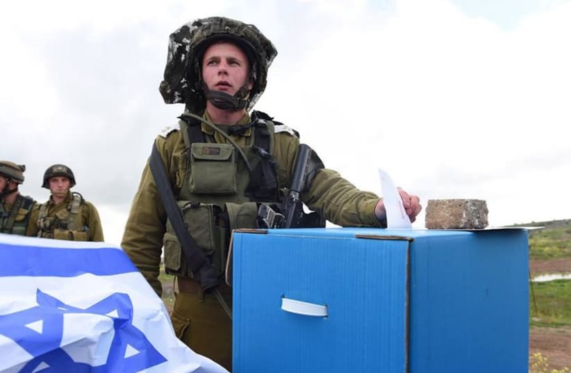 Israeli soldier casts his vote (photo credit: IDF)