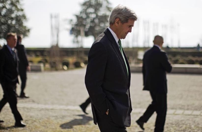 US Secretary of State John Kerry walks around the grounds of the Beau-Rivage hotel during a break in negotiations with Iran's Foreign Minister Javad Zarif over Iran's nuclear program in Lausanne March 17, 2015. (photo credit: REUTERS)
