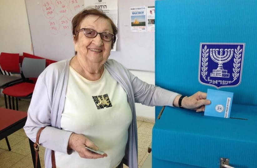 Margalit, 87, casts her vote in the 20th Knesset election. She has voted in every Israeli election so far (photo credit: NIV ELIS)