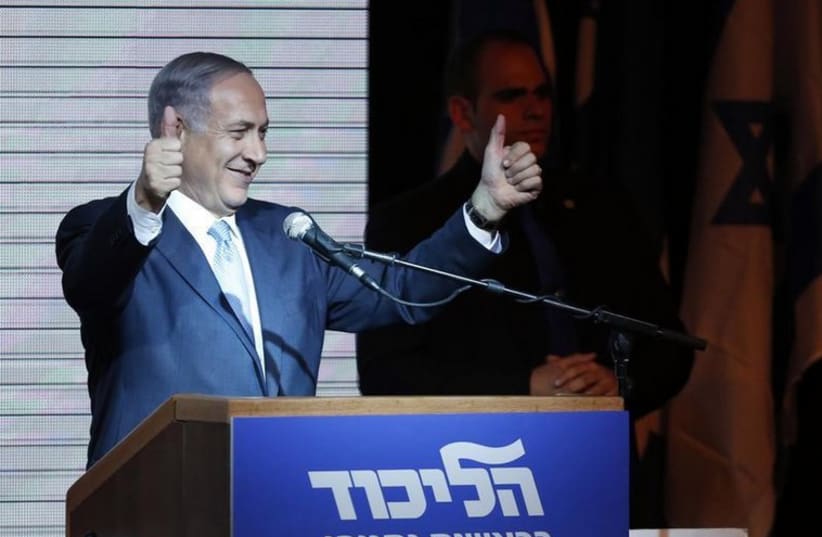 Prime Minister Benjamin Netanyahu gestures during his victory speech at Likud headquarters (photo credit: REUTERS)