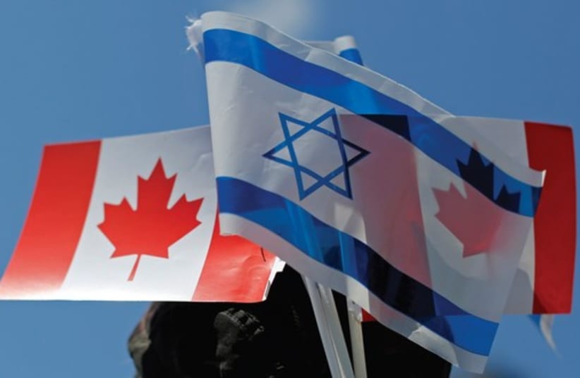 The flags of Israel and Canada (photo credit: REUTERS)