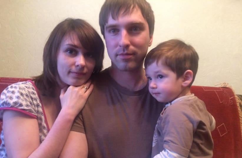 Ilya, Lubov and their child Feodor (Teddy) Tokachov in their one room apartment in Kiev (photo credit: SAM SOKOL)