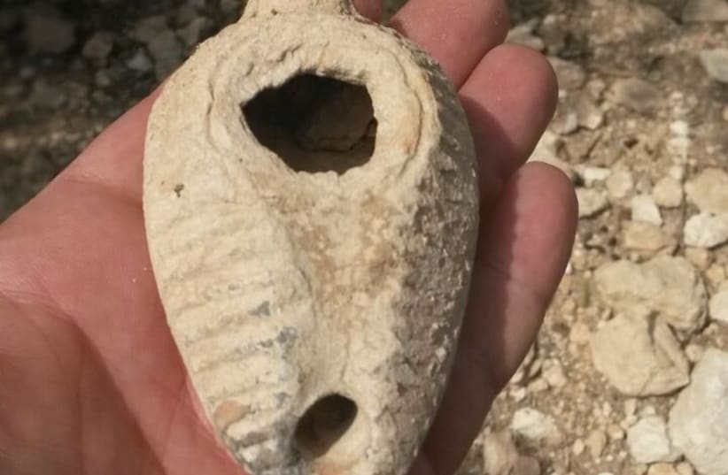 Ancient oil lamp discovered in Emek Hefer. (photo credit: COURTESY OF ISRAEL ANTIQUITIES AUTHORITY)