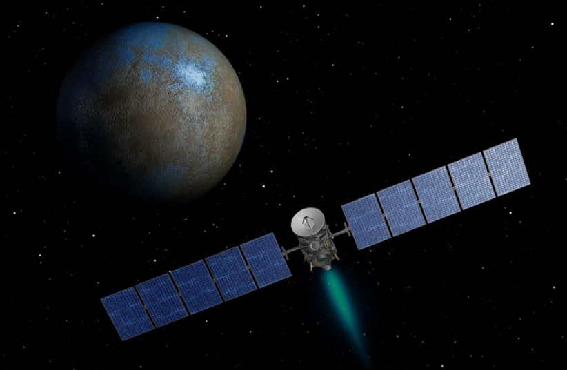 NASA's Dawn spacecraft heads toward the dwarf planet Ceres as seen in this undated artist's conception (photo credit: REUTERS)