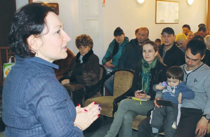 UKRAINIAN REFUGEES receive a briefing on Israel prior to their immigration (photo credit: SAM SOKOL)