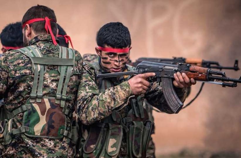 Fighters of the Kurdish People’s Protection Units (YPG) in training at a military camp in Ras al-Ain, February 13 (photo credit: REUTERS)
