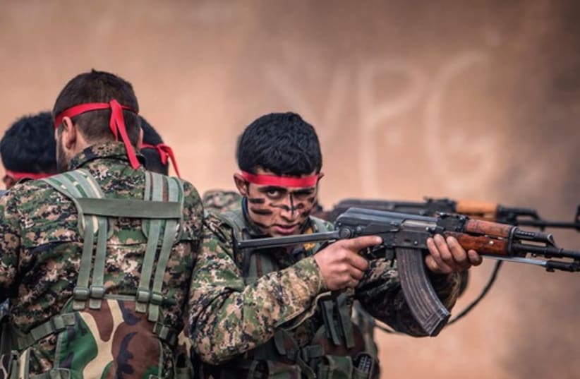 Fighters of the Kurdish People’s Protection Units (YPG) in training at a military camp in Ras al-Ain, February 13 (photo credit: REUTERS)