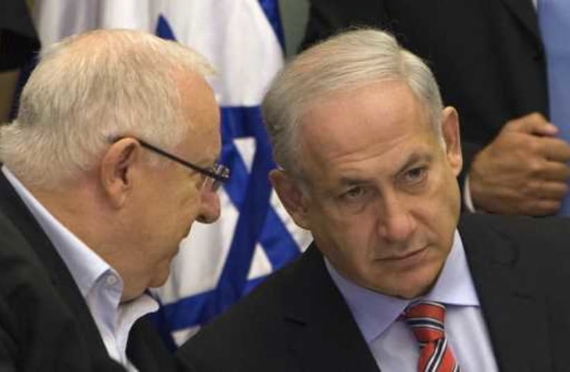 Prime Minister Benjamin Netanyahu listens to President Reuven Rivlin (photo credit: REUTERS)
