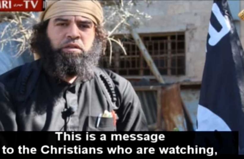  ISIS Video Shows Kidnapped Assyrian Christian Converting to Islam; Jihadists Call It 'Voluntary' (photo credit: MEMRI)