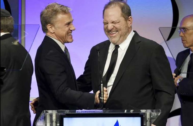 Harvey Weinstein (right), co-chairman of The Weinstein Company and recipient of the Humanitarian Award from the Simon Wiesenthal Center, is introduced by actor Christoph Waltz at the ceremony in Beverly Hills, California. (photo credit: KEVORK DJANSEZIAN/REUTERS)
