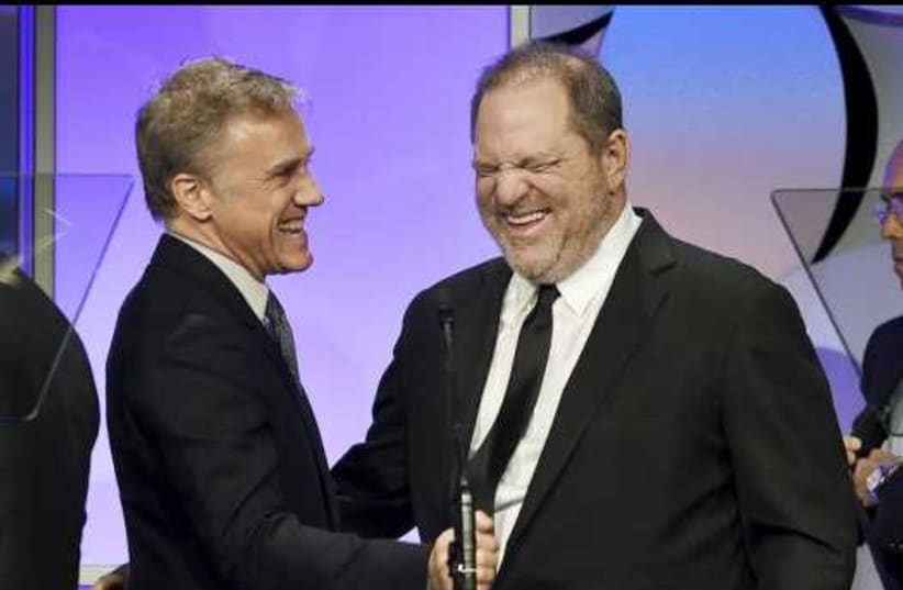 Harvey Weinstein (right), co-chairman of The Weinstein Company and recipient of the Humanitarian Award from the Simon Wiesenthal Center, is introduced by actor Christoph Waltz at the ceremony in Beverly Hills, California. (photo credit: KEVORK DJANSEZIAN/REUTERS)