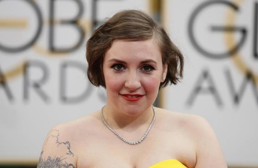 Actress Lena Dunham arrives at the 71st annual Golden Globe Awards in Beverly Hills, California  (photo credit: REUTERS)