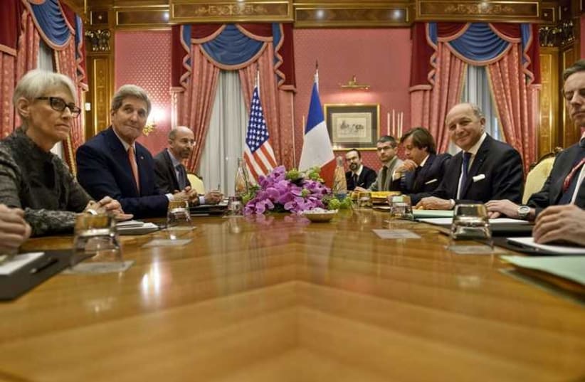 Kerry (2nd L) and French FM Fabius (2nd R) wait for a meeting in Lausanne  March 28, 2015. (photo credit: REUTERS)