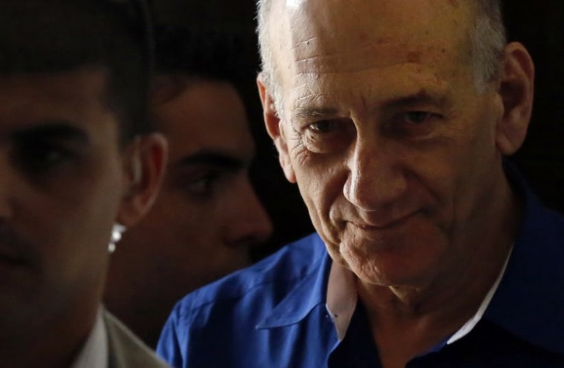 Former Prime Minister Ehud Olmert leaves Tel Aviv District Court, May 13, 2014 (photo credit: REUTERS)