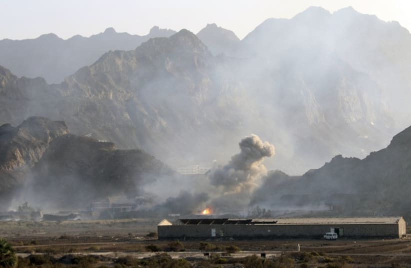 Smoke rises from an arms depot at the Jabal Hadeed military compound in Aden March 28 (photo credit: REUTERS)
