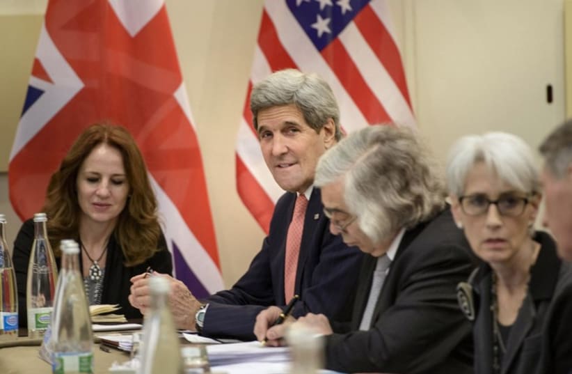 Kerry waits prior to a meeting in Lausanne March 30, 2015.  (photo credit: REUTERS)