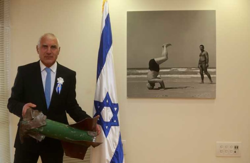 Yesh Atid's Haim Jellin brings Kassam rocket to Knesset as he's set to be sworn in (photo credit: MARC ISRAEL SELLEM/THE JERUSALEM POST)