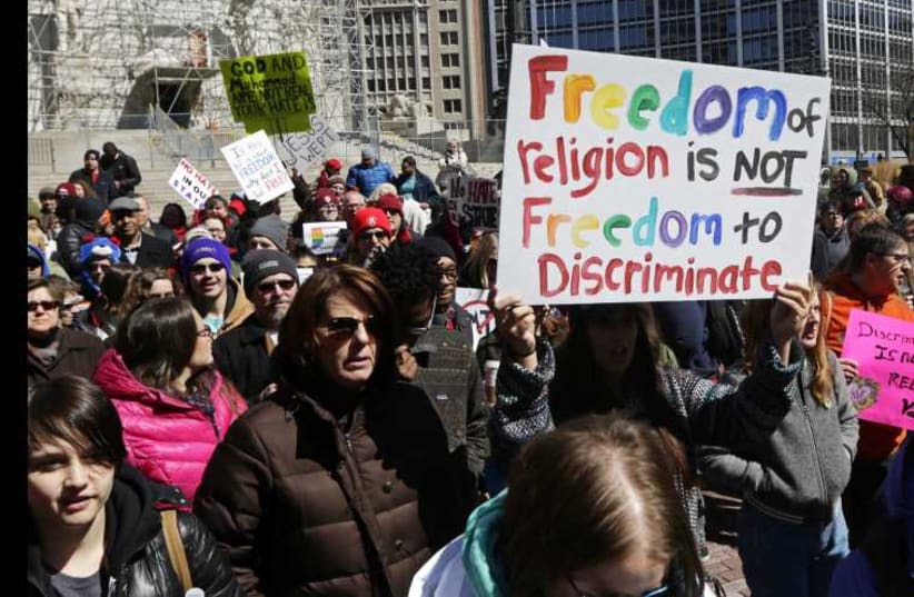 Demonstrators in Indiana gather to protest a controversial religious freedom bill recently signed by Governor Mike Pence (photo credit: REUTERS)