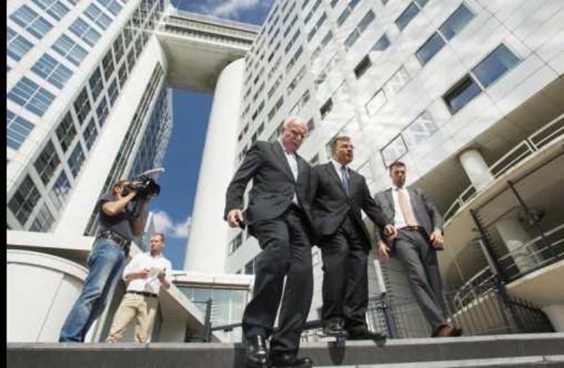 Palestinian Authority Foreign Minister Riad al-Malki (C) leaves the ICC at the Hague, August 5, 2014 (photo credit: REUTERS)