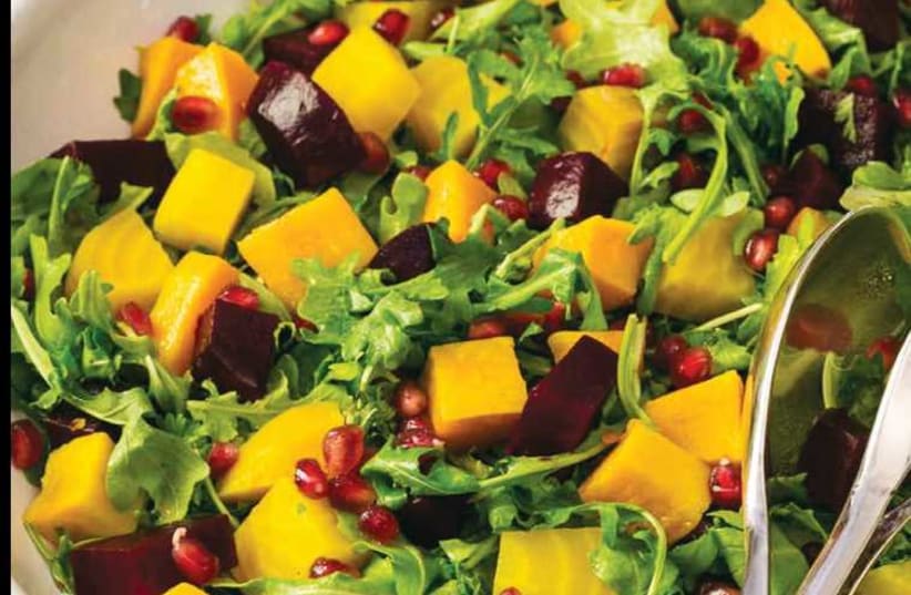 Paula Shoyer's roasted beet and butternut squash salad with pomegranate seeds and orange dressing. (photo credit: MICHAEL BENNETT KRESS)