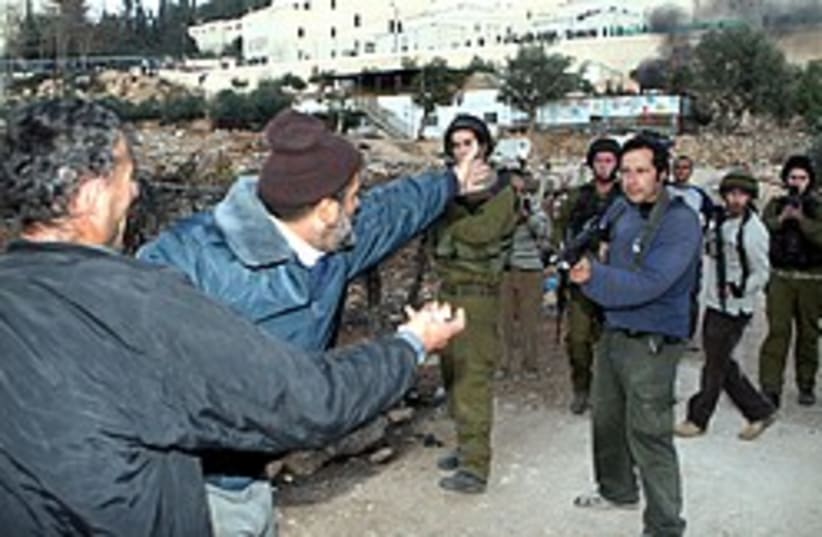 hebron army settler guns cool 248 88 (photo credit: Ariel Jerozolimksi)