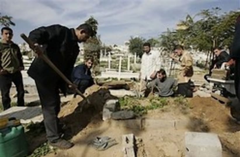burying gaza dead 248.88 ap (photo credit: AP)