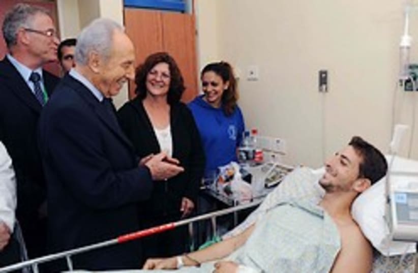 peres wounded soldier 248.88 (photo credit: GPO)