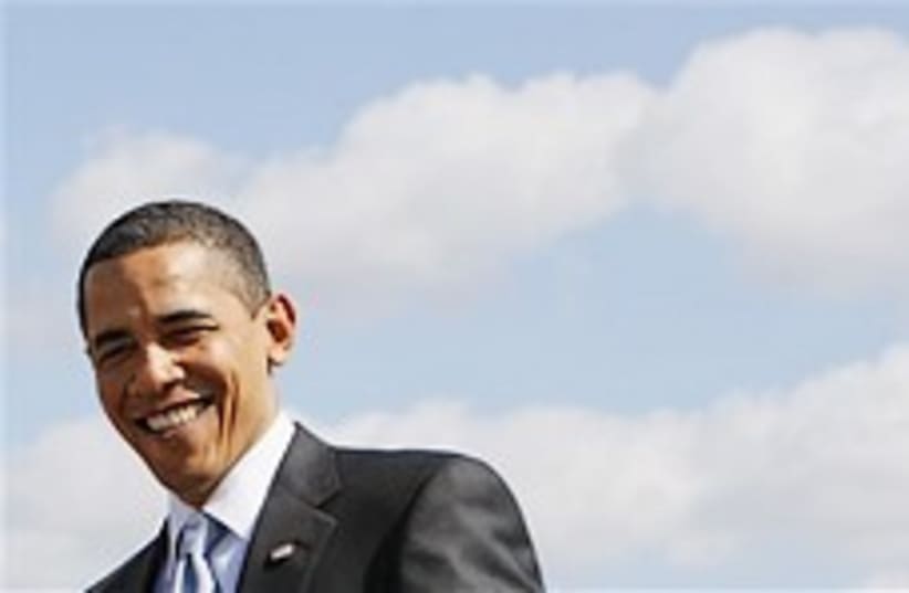 obama smiling in the sky 248.88 (photo credit: AP)